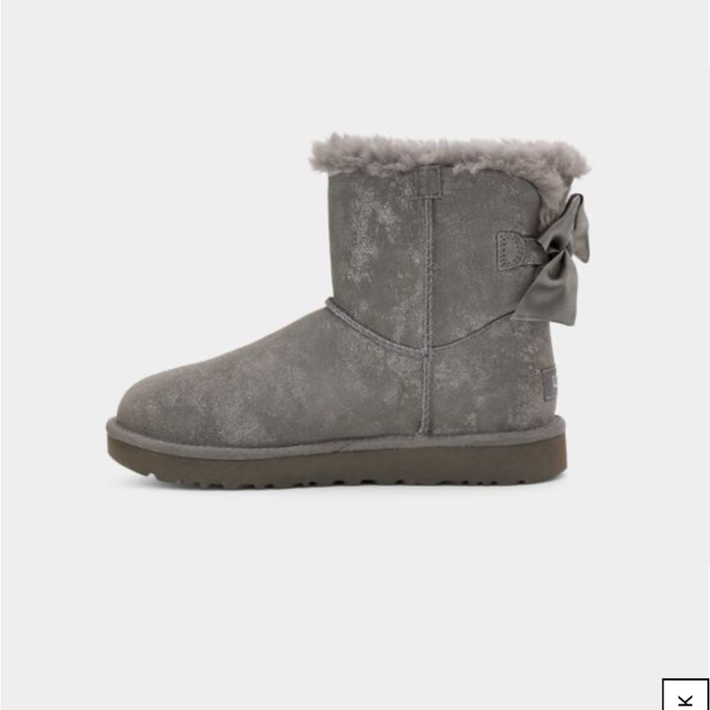 Suede grey uggs with leather bow.